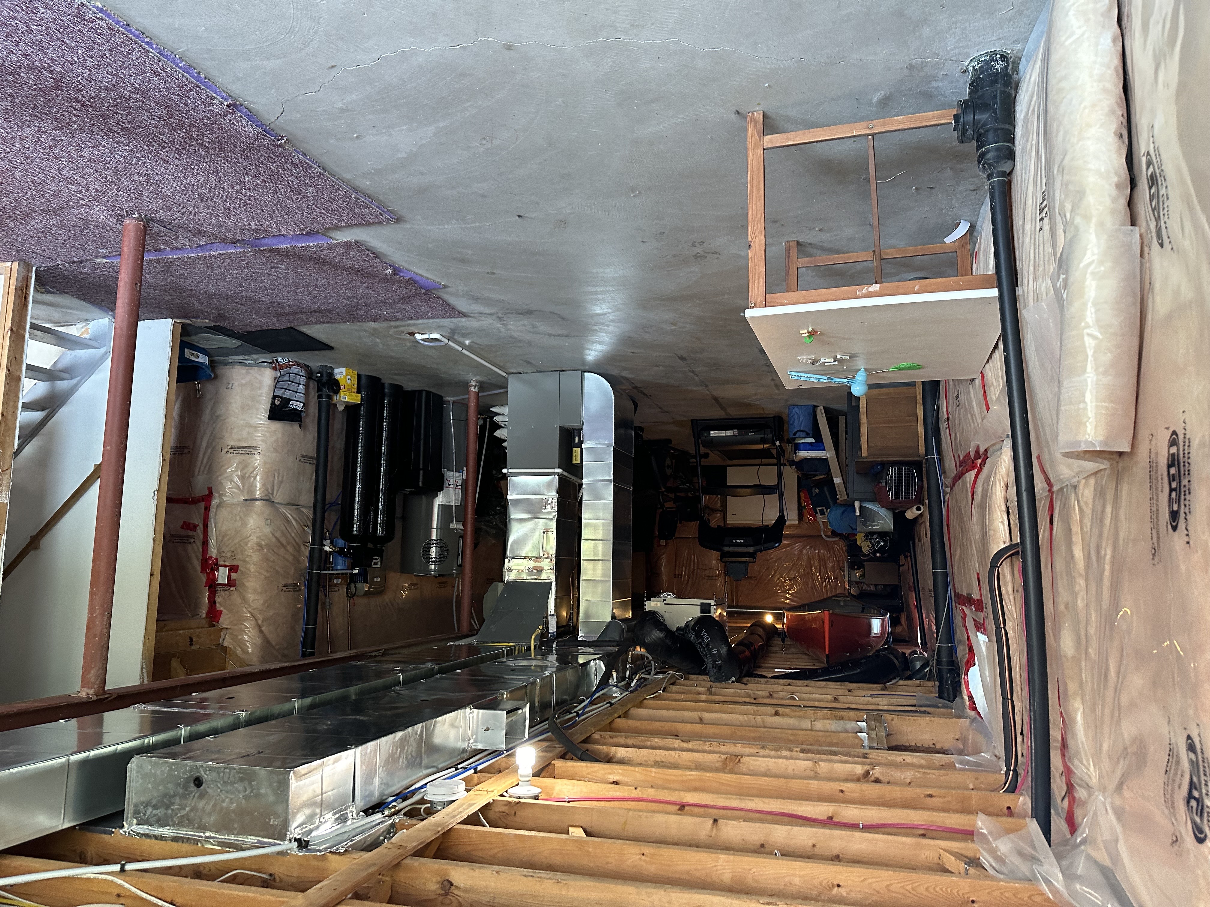 Before: Plumbing wall and bar area